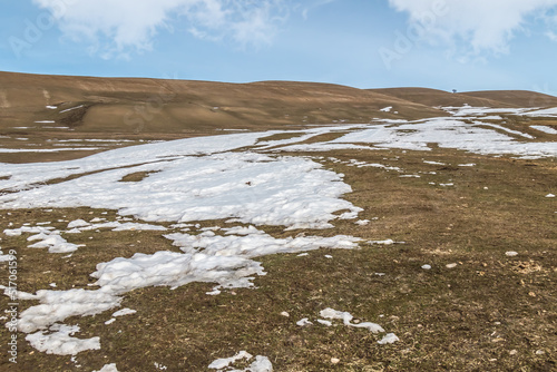 Melting snow on the hills in the foothills of Kazakhstan