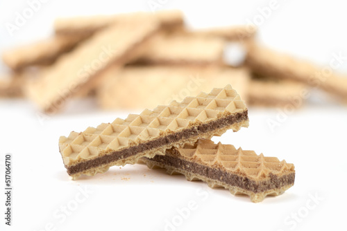 Delicious chocolate wafer on bright background. Close up view. Selective focus.
