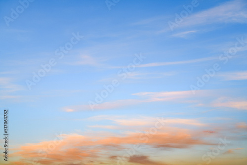 Orange clouds on blue sky in morning 