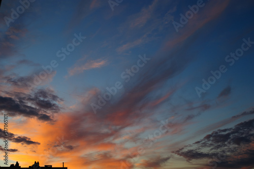 Scenic view of sunset sky with orange light in clouds 