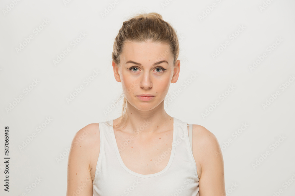 Portrait of a beautiful young women, dressed white T-shirt , isolated on white.emotional portrait of a young Ukrainian girl Portrait of a beautiful young women, dressed white T-shirt , isolated on white.emotional portrait of a young Ukrainian girl
