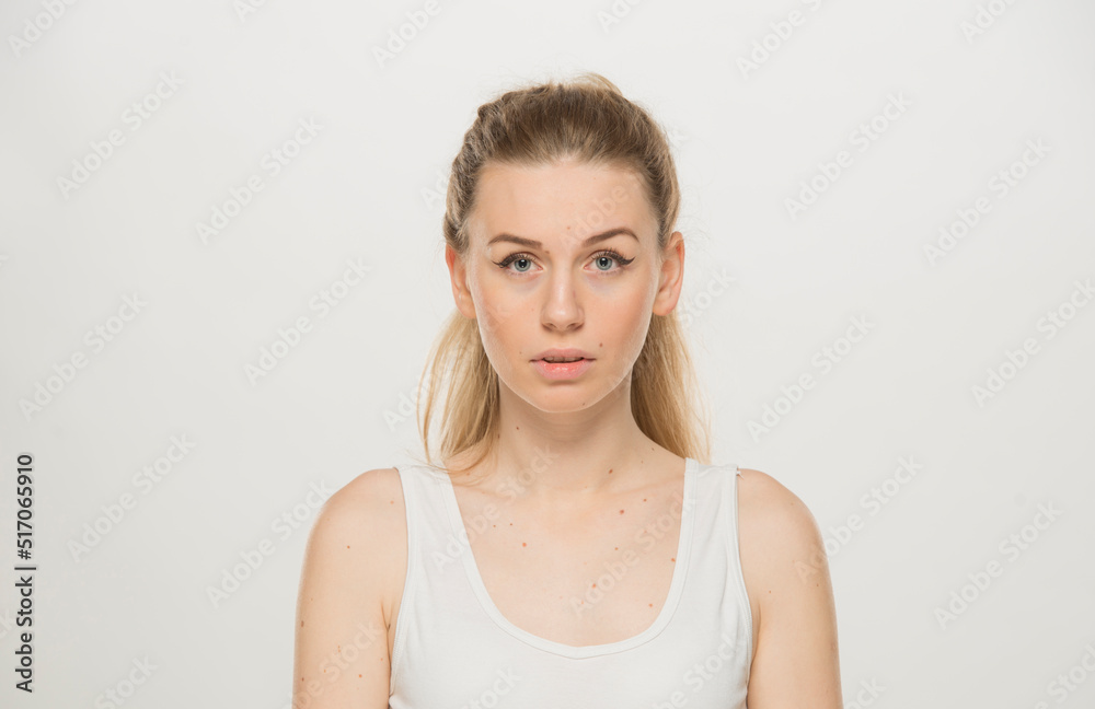 Portrait of a beautiful young women, dressed white T-shirt , isolated on white.emotional portrait of a young Ukrainian girl Portrait of a beautiful young women, dressed white T-shirt , isolated on white.emotional portrait of a young Ukrainian girl
