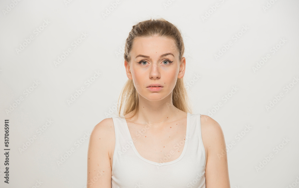 Portrait  of a beautiful young women, dressed white T-shirt , isolated on white.emotional portrait of a young Ukrainian girl