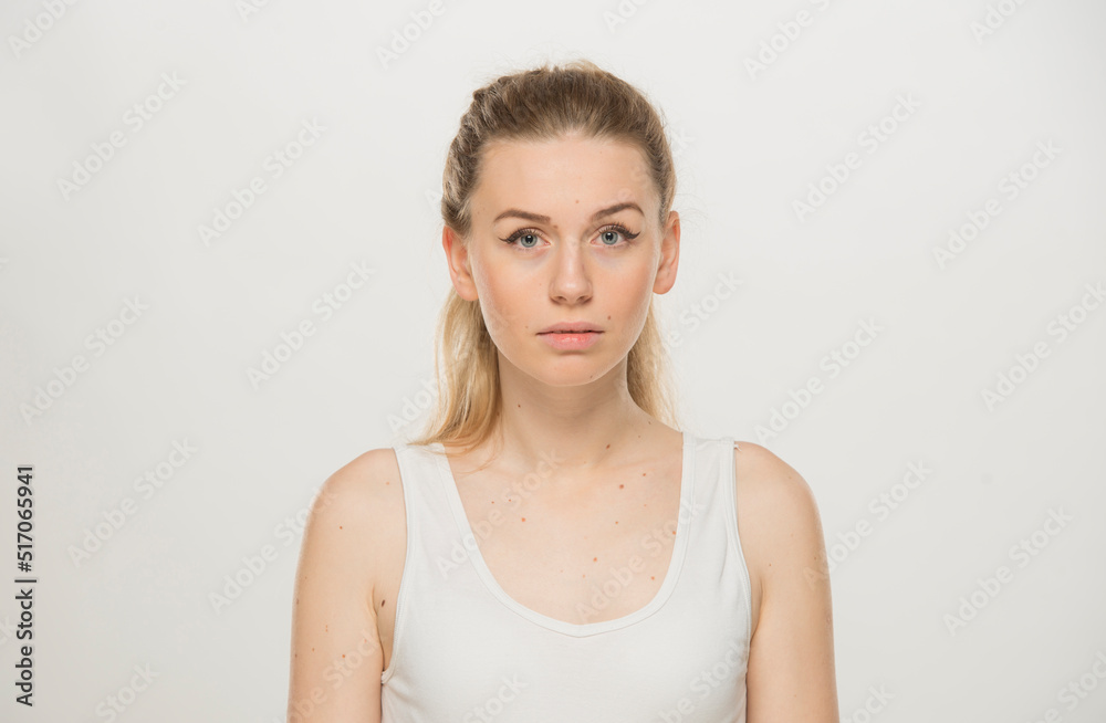 Portrait of a beautiful young women, dressed white T-shirt , isolated on white.emotional portrait of a young Ukrainian girl Portrait of a beautiful young women, dressed white T-shirt , isolated on white.emotional portrait of a young Ukrainian girl