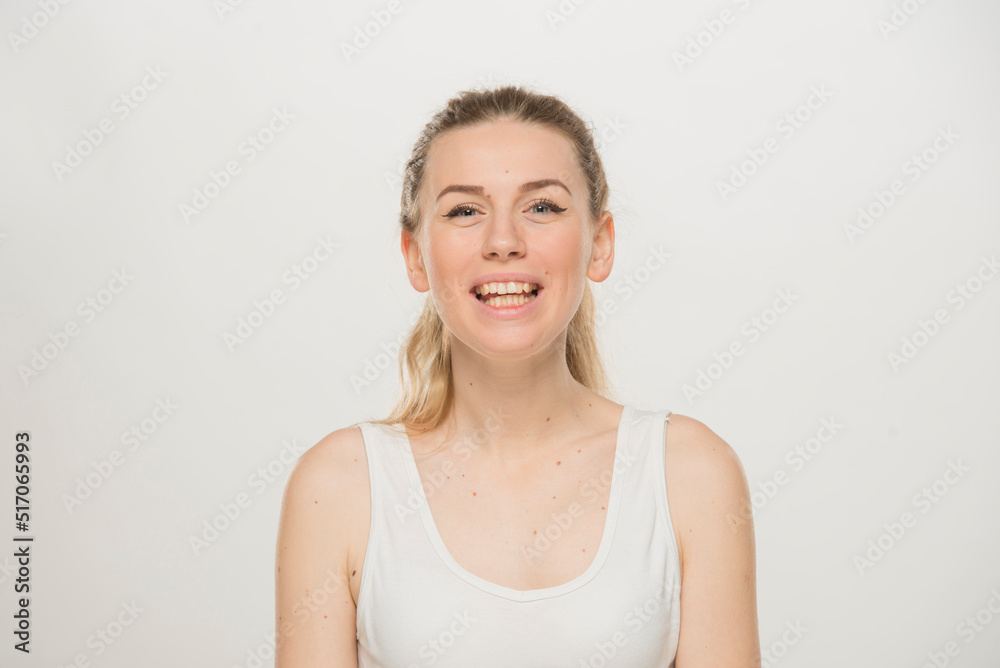 Portrait of a beautiful young women, dressed white T-shirt , isolated on white.emotional portrait of a young Ukrainian girl Portrait of a beautiful young women, dressed white T-shirt , isolated on white.emotional portrait of a young Ukrainian girl
