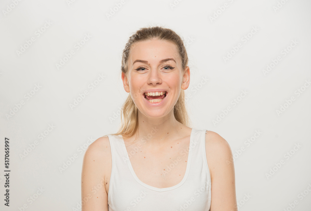 Portrait of a beautiful young women, dressed white T-shirt , isolated on white.emotional portrait of a young Ukrainian girl Portrait of a beautiful young women, dressed white T-shirt , isolated on white.emotional portrait of a young Ukrainian girl