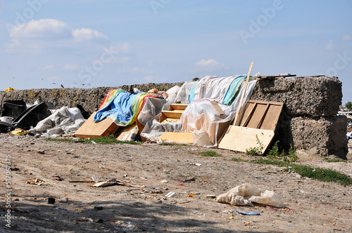 Polluted area with old furniture and plastic garbadge in the landfill