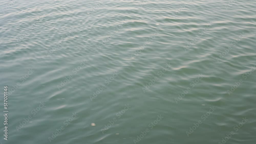 Background of River Water surface ripple flowing stream in river, Environment powerful of natural clean reflection for relax or rest outdoor. Closeup flow water background. Background of River Water surface ripple flowing stream in river, Environment powerful of natural clean reflection for relax or rest outdoor. Closeup flow water background.