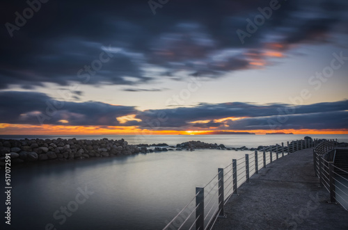 Fototapeta Naklejka Na Ścianę i Meble -  Sunrise on Reis Magos beach. Canico, Madeira, Portugal. October 2021. Long exposure picture