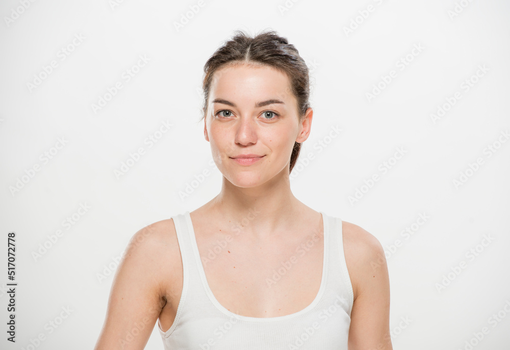 Close-up portrait of a beautiful young woman dressed in a white t-shirt isolated on white.'portrait of a young Ukrainian girl with different emotions Close-up portrait of a beautiful young woman dressed in a white t-shirt isolated on white.'portrait of a young Ukrainian girl with different emotions