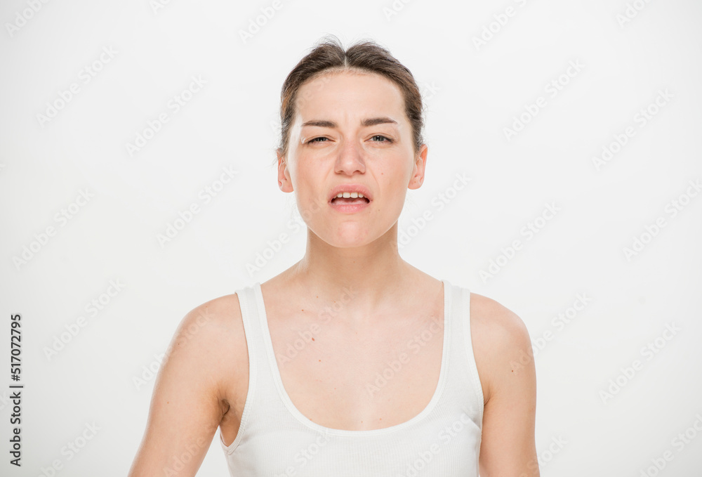 Close-up portrait of a beautiful young woman dressed in a white t-shirt isolated on white.'portrait of a young Ukrainian girl with different emotions Close-up portrait of a beautiful young woman dressed in a white t-shirt isolated on white.'portrait of a young Ukrainian girl with different emotions