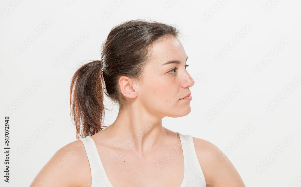 Close-up portrait of a beautiful young woman dressed in a white t-shirt isolated on white.'portrait of a young Ukrainian girl with different emotions Close-up portrait of a beautiful young woman dressed in a white t-shirt isolated on white.'portrait of a young Ukrainian girl with different emotions