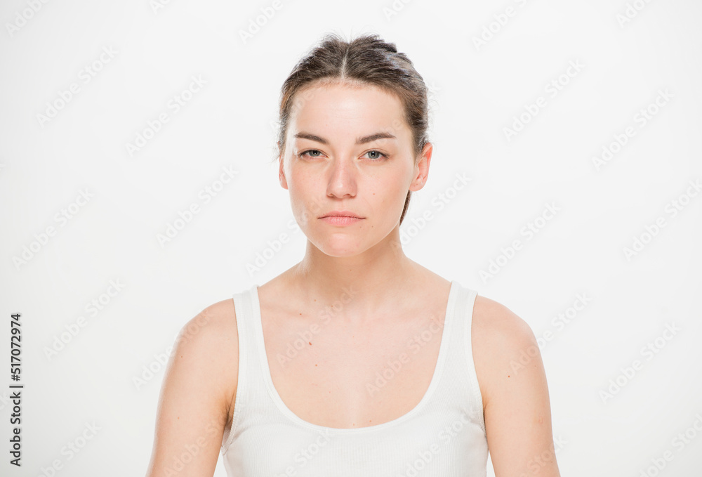 Close-up portrait of a beautiful young woman dressed in a white t-shirt isolated on white.'portrait of a young Ukrainian girl with different emotions Close-up portrait of a beautiful young woman dressed in a white t-shirt isolated on white.'portrait of a young Ukrainian girl with different emotions
