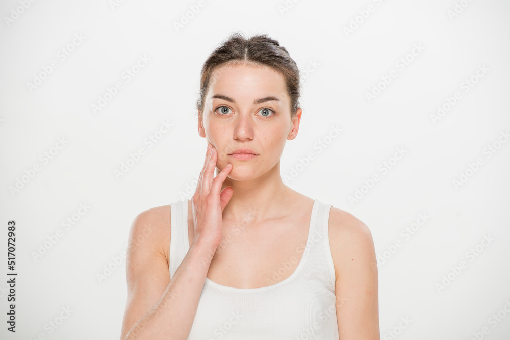 Close-up portrait of a beautiful young woman dressed in a white t-shirt isolated on white.'portrait of a young Ukrainian girl with different emotions Close-up portrait of a beautiful young woman dressed in a white t-shirt isolated on white.'portrait of a young Ukrainian girl with different emotions