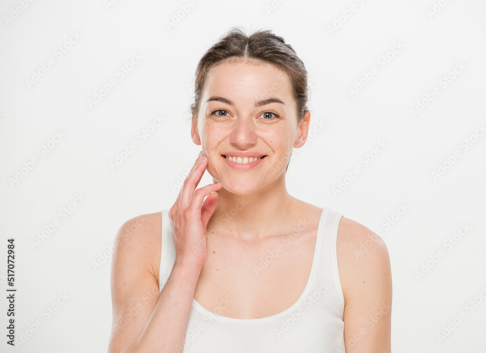 Close-up portrait of a beautiful young woman dressed in a white t-shirt isolated on white.'portrait of a young Ukrainian girl with different emotions Close-up portrait of a beautiful young woman dressed in a white t-shirt isolated on white.'portrait of a young Ukrainian girl with different emotions