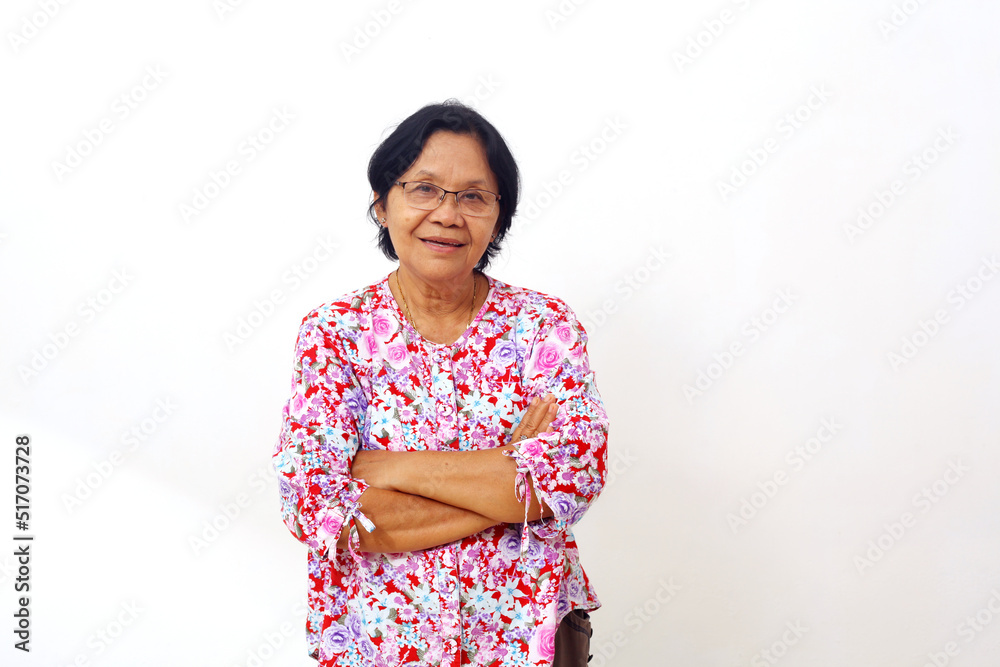 Happy asian elderly senior adult woman standing with arm folded. Isolated on white background Happy asian elderly senior adult woman standing with arm folded. Isolated on white background