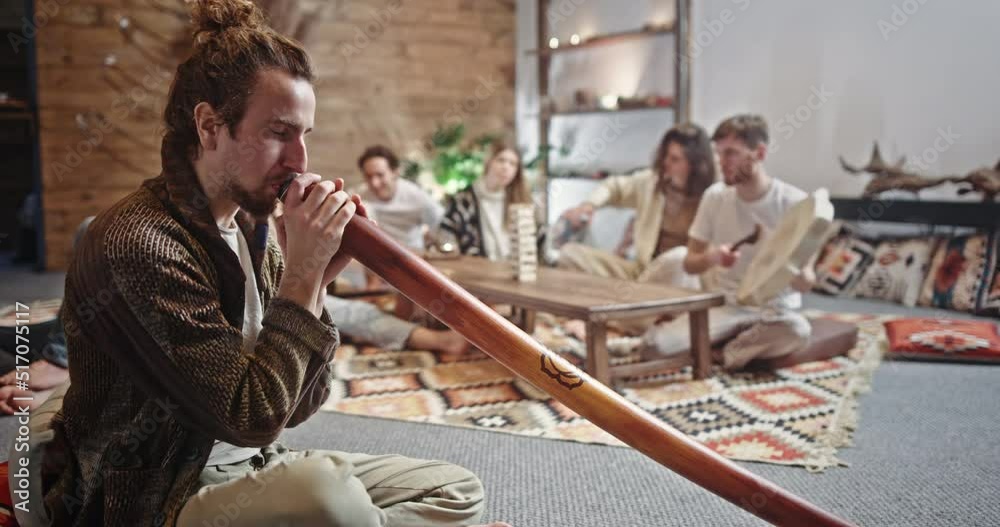 Group of hippie friends playing assorted musical instruments. Group of ...
