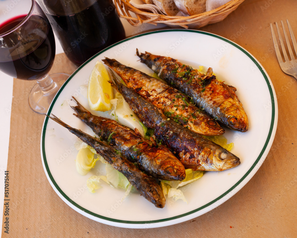 Roasted sardines with lemon, popular spanish dish