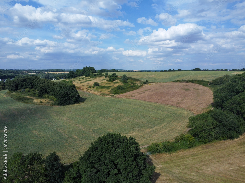 Obraz premium Aerial view of farming fields and woodland in Hertfordshire