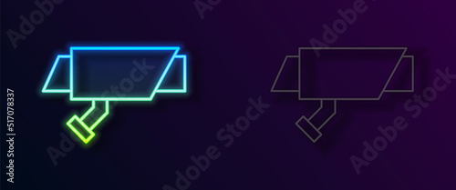 Glowing neon line Security camera icon isolated on black background. Vector