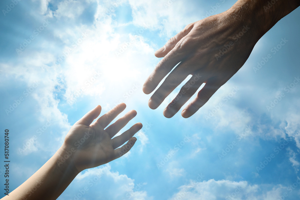 Godparent with child and beautiful blue sky with fluffy clouds on background, closeup Godparent with child and beautiful blue sky with fluffy clouds on background, closeup
