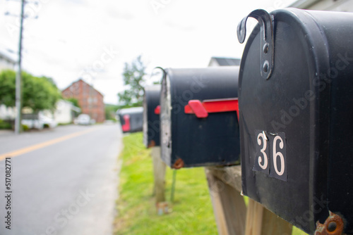 line of street-side residential mailboxes in perspective