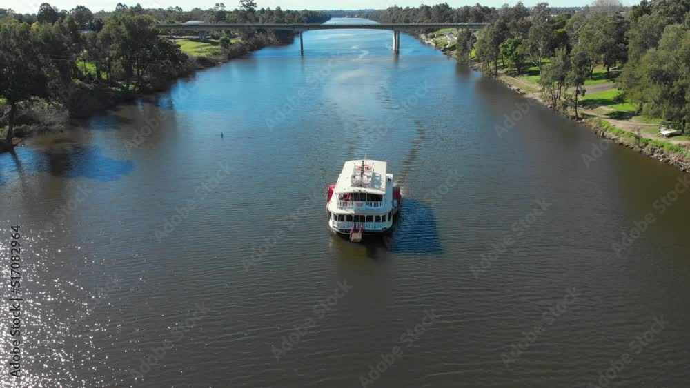 Drone video of the Nepean Belle Paddlewheeler moving along the nepean river on a clear blue sky day Drone video of the Nepean Belle Paddlewheeler moving along the nepean river on a clear blue sky day