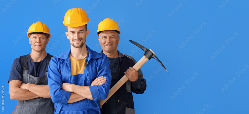 Miner men on blue background with space for text Miner men on blue background with space for text