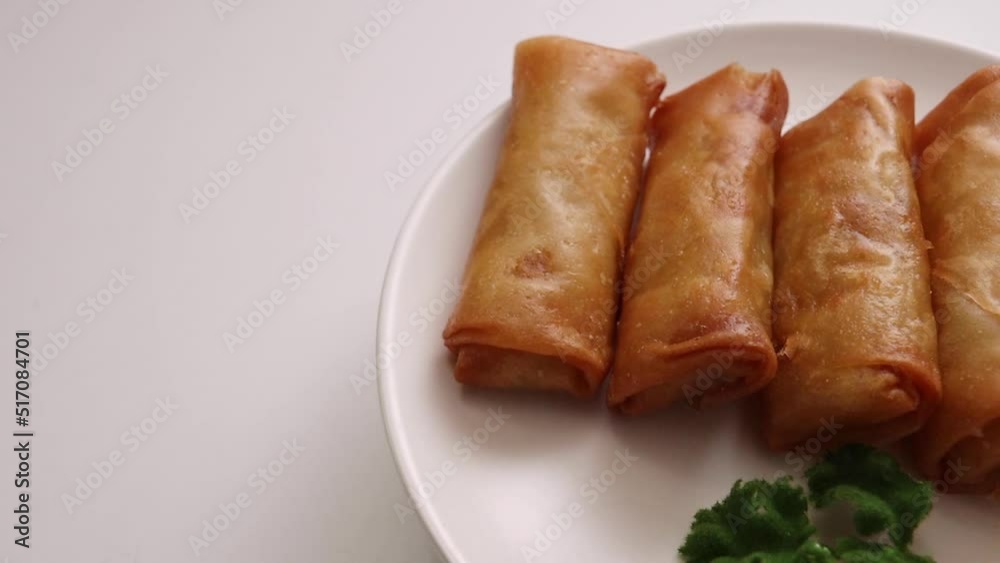 Spring rolls of fried Chinese food that spins on the table