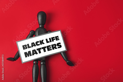 Black mannequin and paper s...
