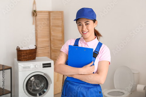 Asian female plumber with c...