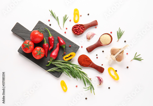 Fototapeta Naklejka Na Ścianę i Meble -  Composition with fresh vegetables, spices and herbs on white background