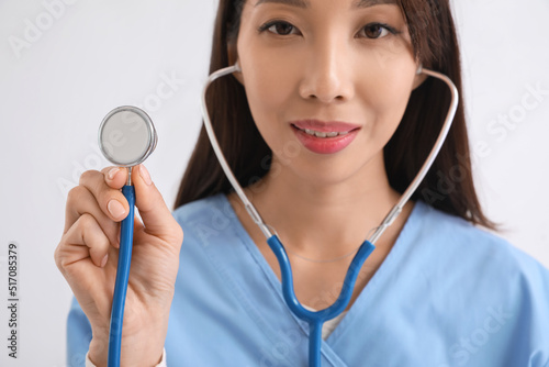 Asian doctor with stethosco...