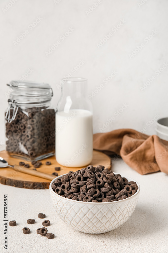Bowl of black cereal rings on light table Bowl of black cereal rings on light table