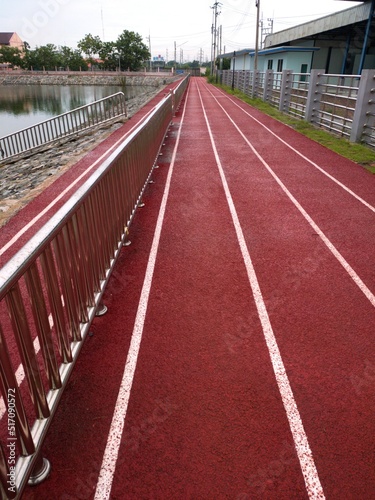 running track in a stadium Red running track in the park after the rain stops