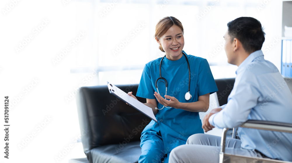 Fototapeta premium Doctor and patient sitting and talking at medical examination at hospital office, close-up. Therapist filling up medication history records. Medicine and healthcare concept.