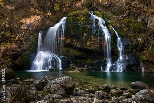 Idyllic Alpine Waterfall of Virje on River Gljun near town Bovec in Julian Alps Slovenia
