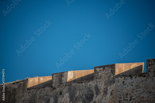 anciente fortress alicante wall with blue sky photo
