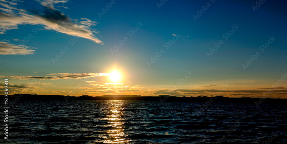 picturesque Golden sunset over a calm lake,