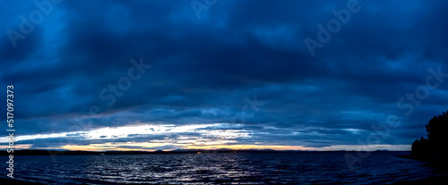 dark blue sunset sky over the lake photo