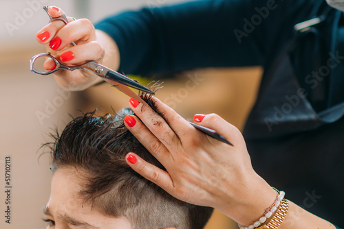 Hairdresser Cutting Boy's Hair