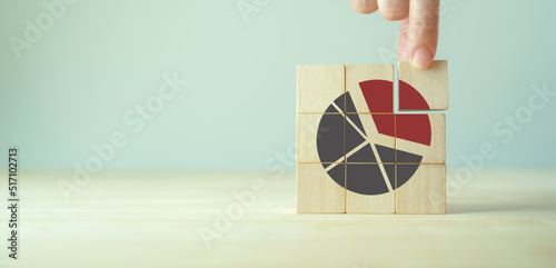 Increase market share, growth of business profit concept. Market penetration and expansion strategies. Wooden cubes showing a market share percentage using a pie chart. Strengthen business strategies.