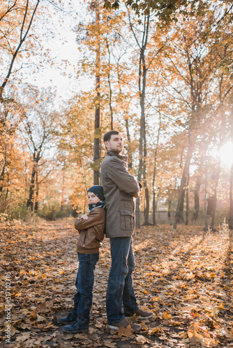 boy with dad in autumn forest with orange leaves © dyachenkopro
