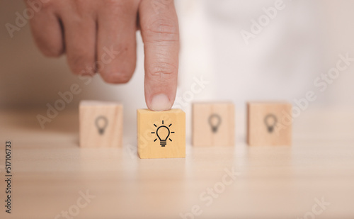 hand pick wooden blocks with thinking and idea icon. Concept for creative and design solution.