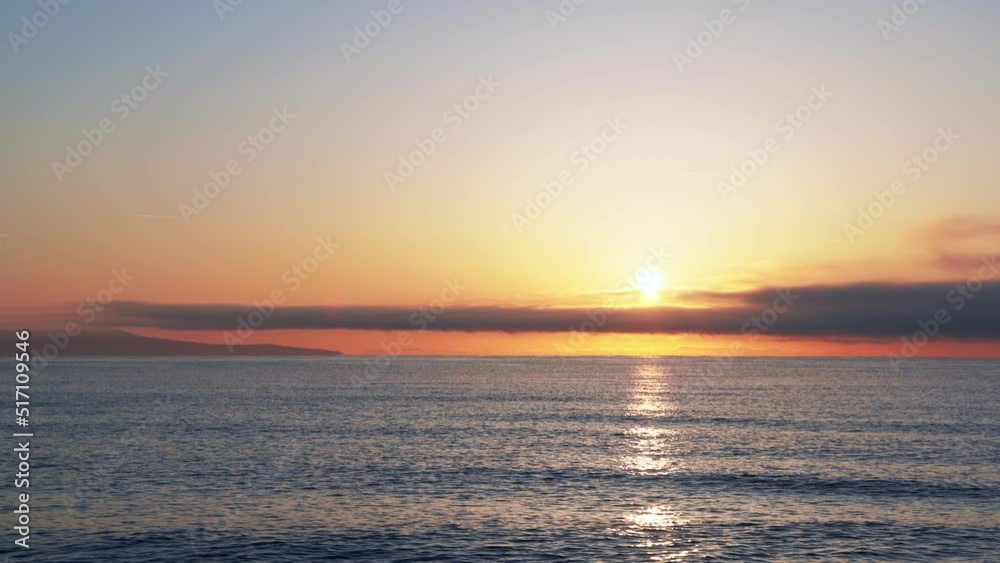 Black Sea with cool water extends beyond the horizon under a sky with clouds and a dawn sun Black Sea with cool water extends beyond the horizon under a sky with clouds and a dawn sun