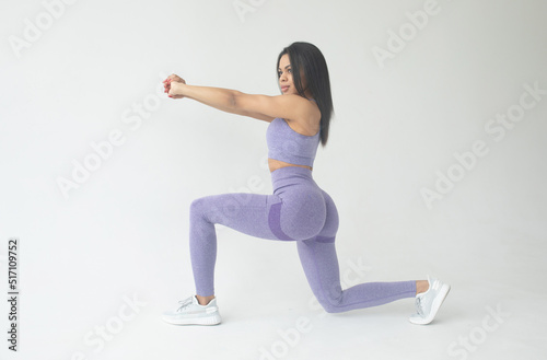 Sexy fitness black woman. Beautiful athletic girl isolated on the grey background.