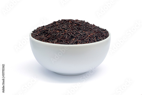 Raw Thai Riceberry in white bowl isolated on white background included clipping path.