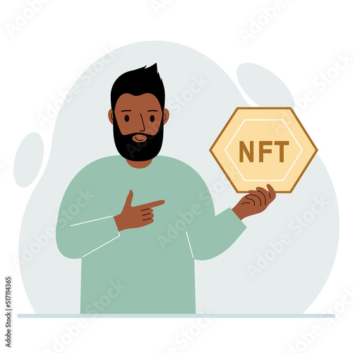 NFT concept. The man is holding nft in his hand. Works of art using non-fungible tokens for auctions, sale and purchase of works of art.