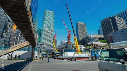 A timelapse of crane at the under construction in Tokyo wide shot zoom photo