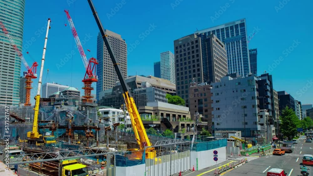 A timelapse of crane at the under construction in Tokyo wide shot zoom